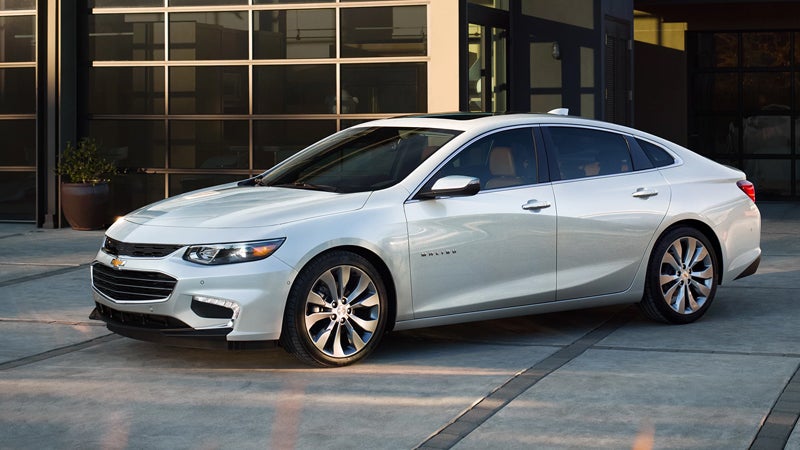 Chevy Malibu dparked in front of a building - Bob Jass Chevrolet in Elburn IL