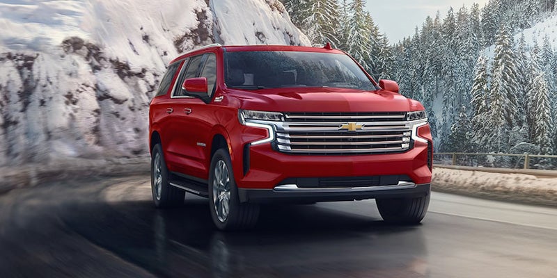 Chevy Suburban driving on the road - Bob Jass Chevrolet in Elburn IL