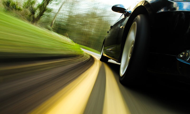 Action shot of a car driving on the road - Bob Jass Chevrolet in Elburn IL